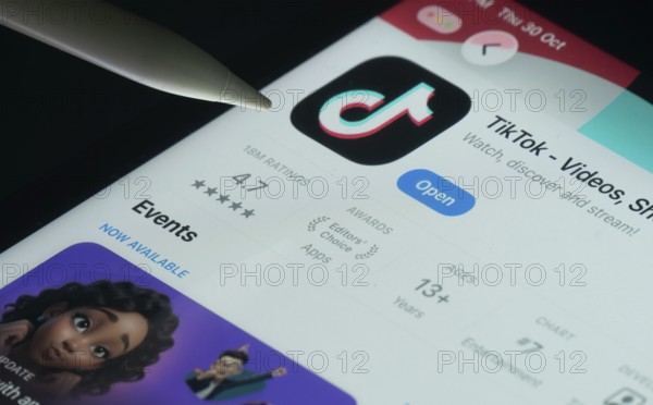 Dhaka, Bangladesh- 30 Oct 2025: TikTok app on a iPad screen with a pen pointing at the install option
