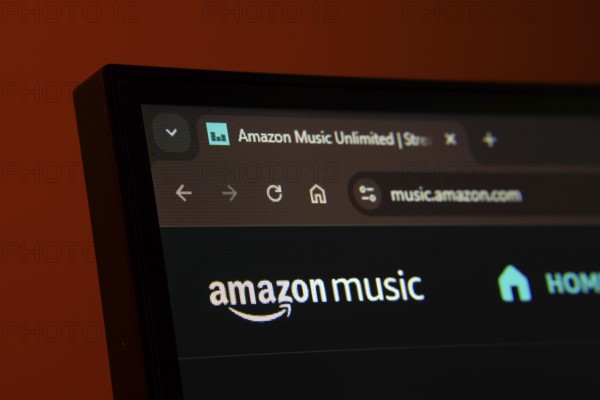 Dhaka, Bangladesh- 21 Nov 2025: Close-up of a computer screen displaying the Amazon Music web interface in dark mode