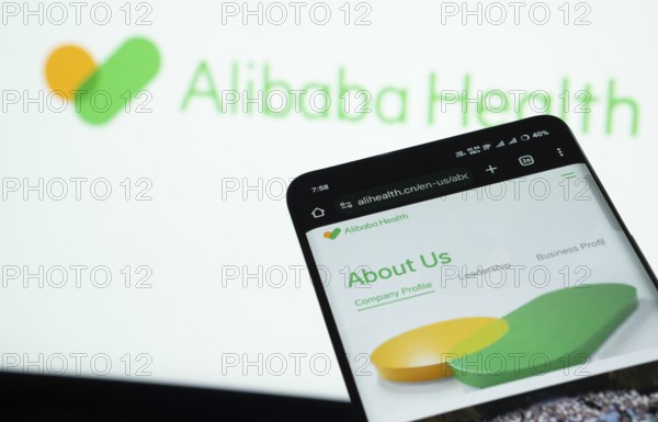 Dhaka, Bangladesh- 21 Nov 2025: Smartphone displaying Alibaba Health web interface against Alibaba Health logo background