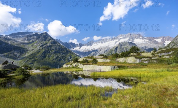 Picturesque mountain landscape, dammastock and damma glaciers reflected in Moorsee, Göscheneralp, Canton of Uri, Switzerland