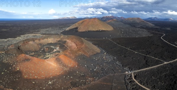 Montaña Quemada and Montaña Pedro Perico volcanoes, volcanic landscape with craters and lava fields, aerial view, Lanzarote, Canary Islands, Spain