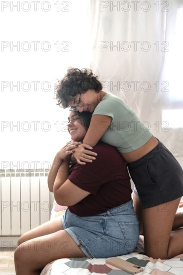 A loving couple enjoying a tender moment together in a sunlit room. They are smiling and gazing at each other, surrounded by a serene and intimate atmosphere