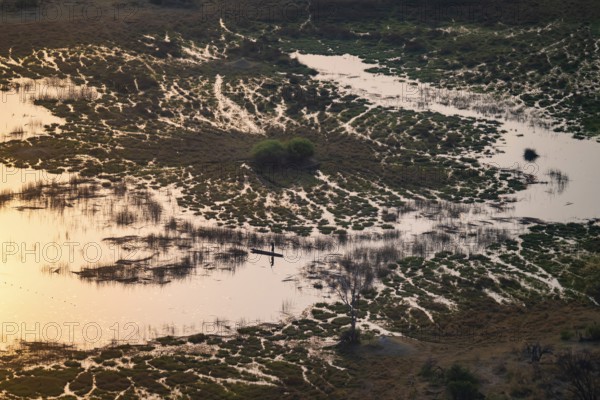 Marshland, marshland, Kavango fishermen with dugout boat, Mokoro, aerial view, Okavango Delta, Botswana