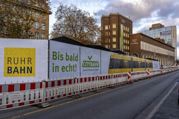 Construction site of the stop at the main train station, for the new city railway, visualization of the full-size tram, a new tram line over 5 km long, which will connect the west of Essen, the new district 51, with the city center, from 2026, Essen, North Rhine-Westphalia, Germany