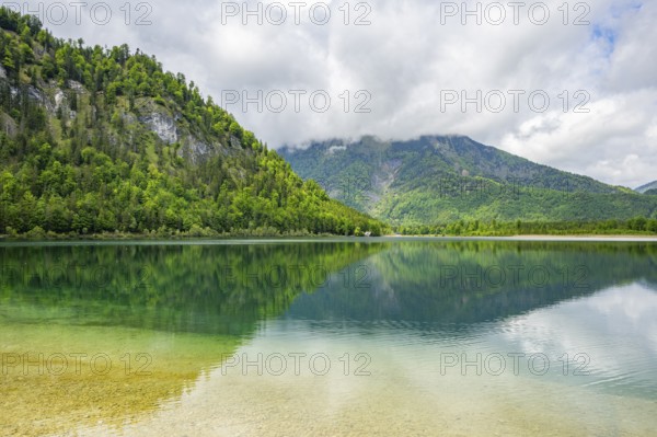 Landscape of Lake Offensee after rain when the sun comes through the clouds in spring, Salzkammergut, Austria
