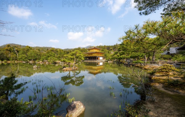 Golden Pavilion reflected in pond, Japanese garden, Golden Pavilion Temple, Kinkaku-ji reliquary, Buddhist temple complex, Kyoto, Japan