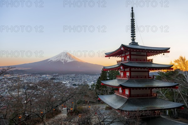 Five-story pagoda of a Shinto Shrine, Chureito Pagoda, with views of Fujiyoshida City and Mount Fuji volcano at sunset, Arakura Fuji Sengen Shrine, Arakurayama Sengen Park, Yamanashi Prefecture, Japan
