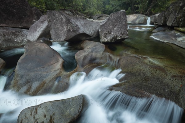 Turquoise blue water between rocks in the tropical rainforest of Babinda Boulders Queensland Australia