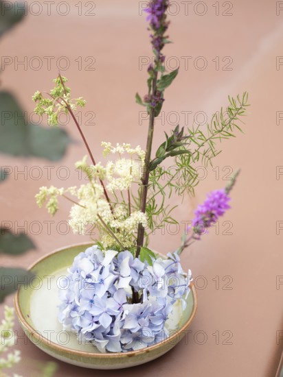 Floral arrangement made with hydrangea, meadowsweet and purple loosestrife during an ikebana workshop