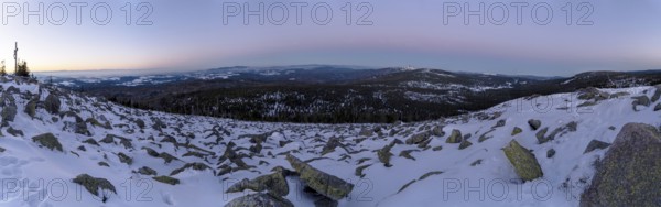 View from Mount Lusen over the hills of the bavarian forest at sunrise in winter, Bavaria, Germany