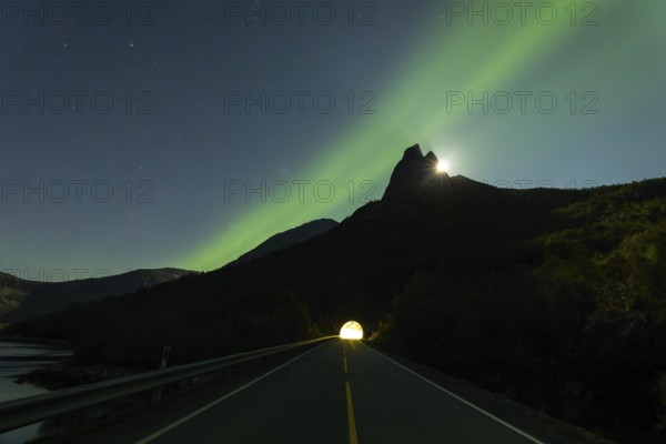 National mountain of Norway - Stetind in the Nordland under auroras and a full moon