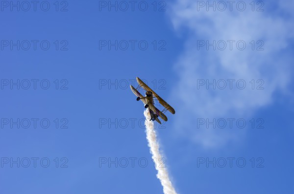 A Boeing PT-17 Stearman biplane, also Boeing Stearman Model 75, with the inscription 399 USNAVY N67193 during a flight demonstration as part of an air show on Rossfeld in Metzingen-Glems, Baden-Württemberg, Germany, for editorial use only