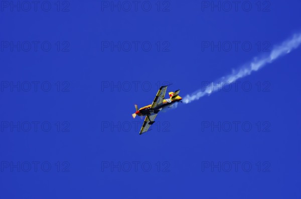 A Votec 351 sport aircraft from the Swiss MSW Aviation AG with registration HB-YMV during a flight demonstration as part of an air show on Rossfeld in Metzingen-Glems, Baden-Württemberg, Germany, for editorial use only
