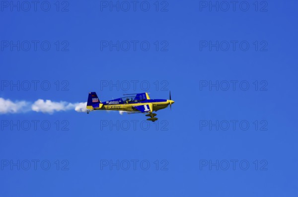 An Extra EA-300 from Extra Flugzeugproduktions- und Vertriebs GmbH with registration D-EXBH during a flight demonstration as part of an air show on Rossfeld in Metzingen-Glems, Baden-Württemberg, Germany, for editorial use only