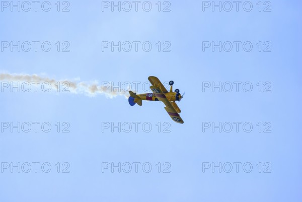 A Boeing-Stearman biplane during a flight demonstration as part of an air show at the Rossfeld in Metzingen-Glems, Baden-Württemberg, Germany, for editorial use only