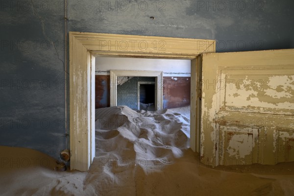 Sand mountains in a former dwelling house, interior photograph, Kolmanskop, restricted diamond area, near Lüderitz, Karas region, Namibia