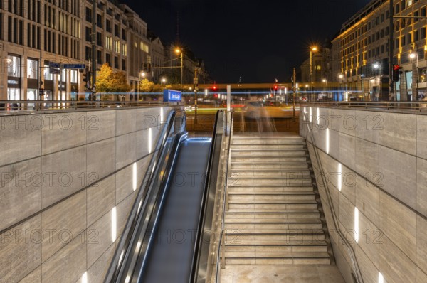 Night photo, long exposure with motion blur, modern underground entrance at Unter den Linden station, contemporary design with stairs and escalator, Berlin, Germany