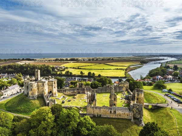 Warkworth Castle over River Coquet from a drone, Warkworth, Northumberland, England, United Kingdom