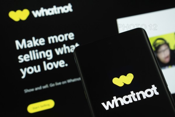 Dhaka, Bangladesh - 18 Sep 2025: The logo of Whatnot is displayed on a smartphone screen, and the website is visible on a computer screen in the background