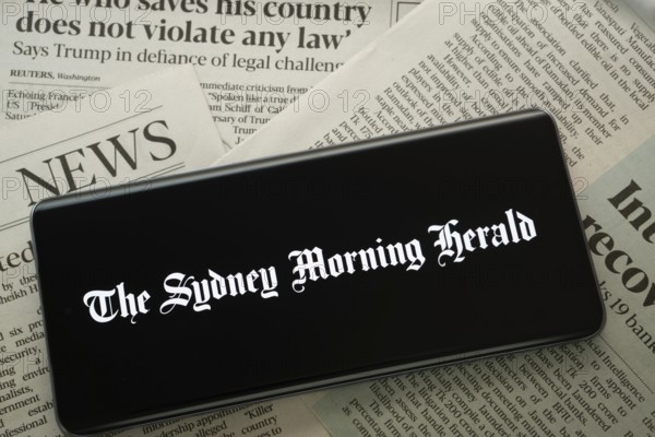 Dhaka, Bangladesh - 18 March 2025: The logo of the sydney morning herald is displayed on a smartphone screen