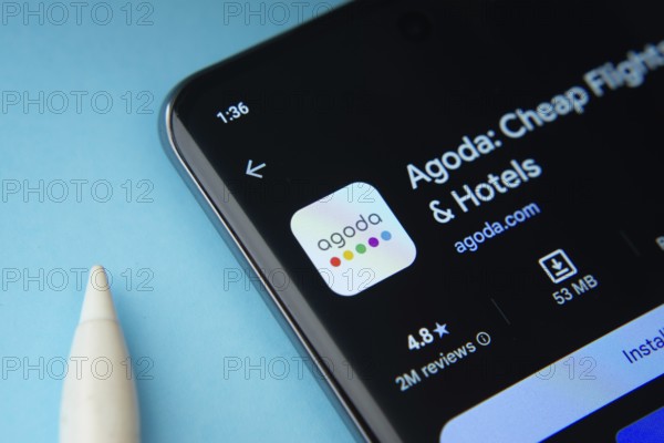 Dhaka, Bangladesh- 27 July 2025: Agoda app from Google Playstore is displayed on a smartphone screen