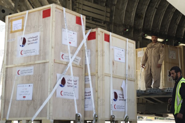 Members of the Qatari Air Force unload humanitarian aid supplies from a transport aircraft at Damascus International Airport as part of Qatar's air and land relief bridge to Syria, Damascus, Damascus, Syria
