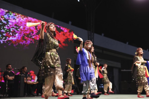 A Kurdish traditional dance troupe performs during the Damascus International Fair, the first edition held after the fall of Bashar al-Assad, showcasing cultural heritage and attracting visitors to the exhibition, Damascus, Damascus, Syria