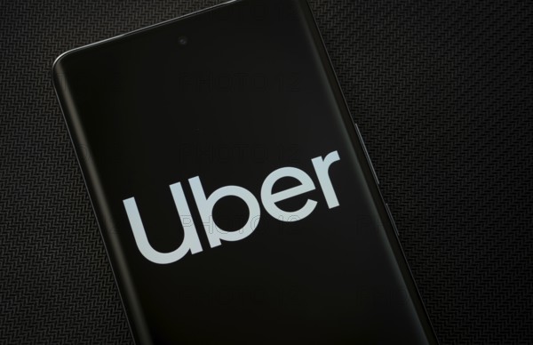 Dhaka, Bangladesh - 17 March 2025: The logo of the Uber is displayed on a smartphone screen