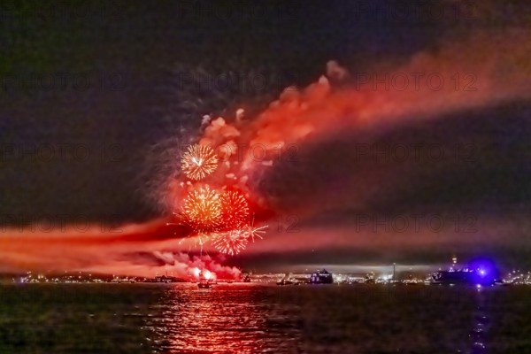 Lake Night Festival Constance. Water fireworks over the German shore and the neighbouring Swiss town of Kreuzlingen. View of the fireworks from Lake Constance. Constance, Baden-Württemberg, Germany