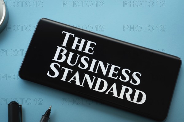 Dhaka, Bangladesh - 18 March 2025: The logo of The business standard is displayed on a smartphone screen