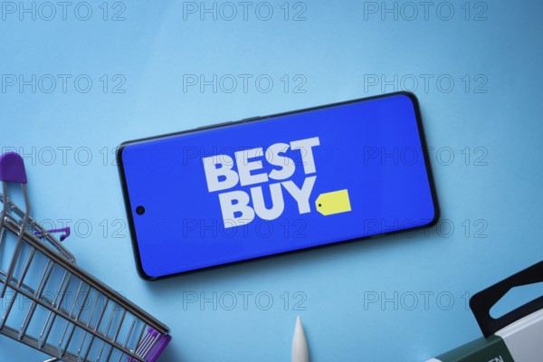 Dhaka, Bangladesh- 03 July 2025: Smartphone displaying Best Buy logo with shopping cart on a blue background