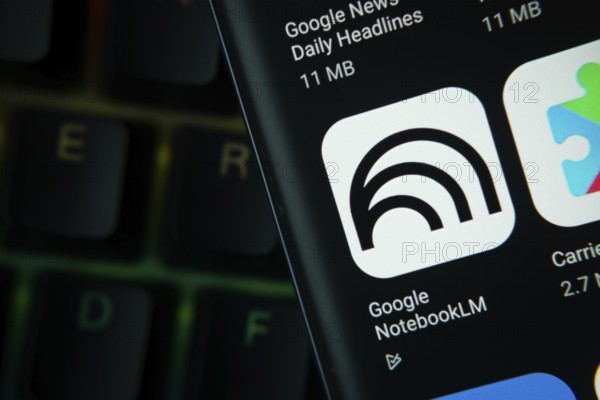 Dhaka, Bangladesh- 27 July 2025: Close-up of smartphone screen showing the Google NotebookLM app icon with a dark interface