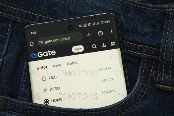 Dhaka, Bangladesh- 15 June 2025: A smartphone displaying the Gate.io web interface peeks out of a denim pocket