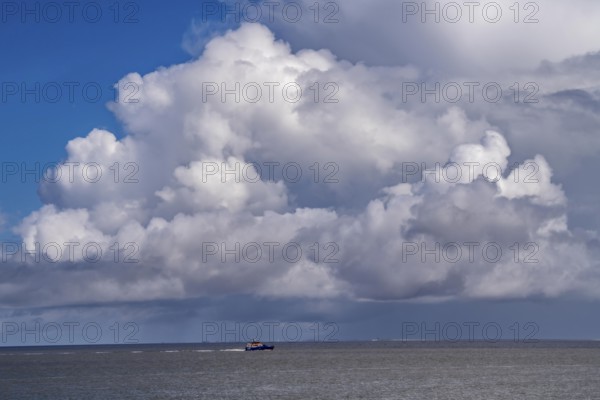 Wadden Sea between the Dutch coast near Eemshaven and the German North Sea island of Borkum, Wadden Sea National Park, UNESCO World Heritage Site, low tide, low water, clouds