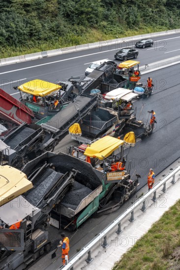 Rehabilitation of the A52 motorway near Essen, an 8 km long section between the Essen-Kettwig junction and the Essen-Ost motorway junction was completely renovated over a period of 9 years, 6 lanes, new drainage pipes, carriageway, bridges, noise barriers, traffic facilities, here the last section, direction Düsseldorf, new carriageway surface, laying of porous asphalt, whispering asphalt, at the Essen-Rüttenscheid junction, North Rhine-Westphalia, Germany