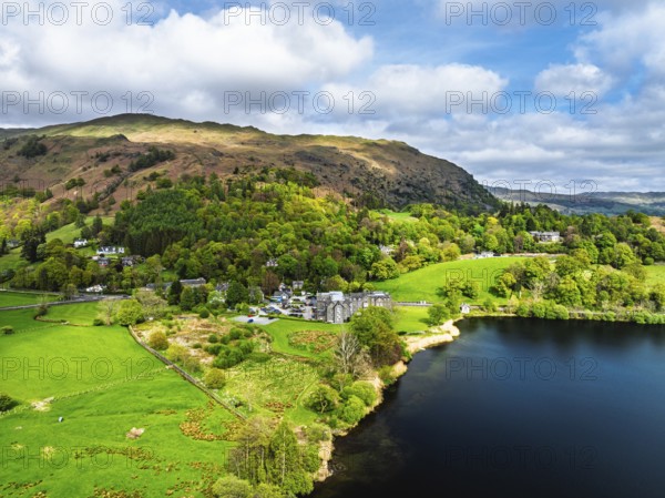 Farms and Mountains over road A591 from a drone, Grasmere Lake, Grasmere, Ambleside, Lake District, Westmorland, Cumbria, UK