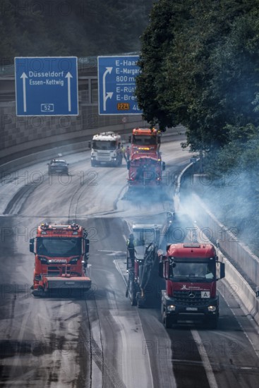 Rehabilitation of the A52 motorway near Essen, an 8 km long section between the Essen-Kettwig junction and the Essen-Ost motorway junction will be completely renovated over a period of 9 years, 6 lanes, new drainage pipes, carriageway, bridges, noise barriers, traffic facilities, here the last section, direction Düsseldorf, new carriageway surface, laying of porous asphalt, here the removal, milling, of the old carriageway in front of the application of the new whispering asphalt, Essen, North Rhine-Westphalia, Germany
