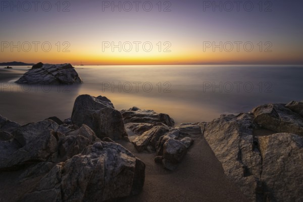 The sun rises on the Costa Rei, a stretch of coastline on the Italian Mediterranean island of Sardinia, Monte Nai, Costa Rei, Sardinia, Italy