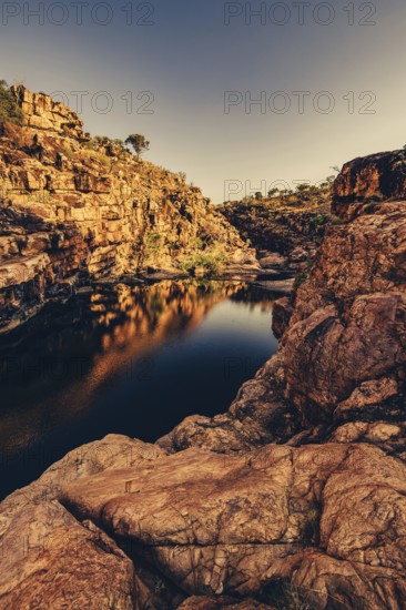 Bell Gorge waterfall, a body of water in north-west Australia in the Kimberley. Sunrise in the outback, Australia