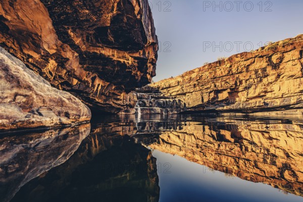 Bell Gorge waterfall, a body of water in north-west Australia in the Kimberley. Sunrise in the outback, Australia