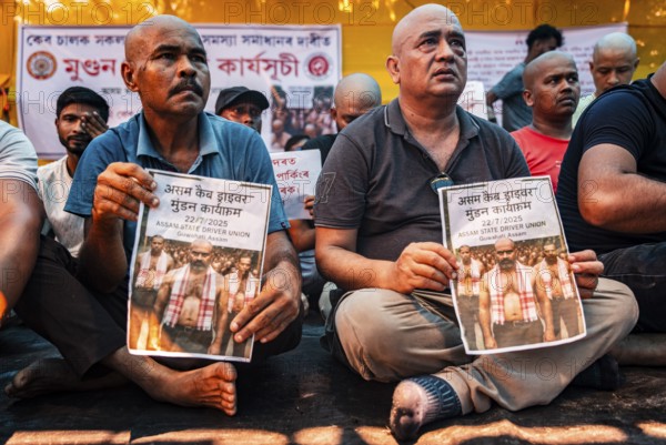 Drivers affiliated with Ola, Uber, and Rapido, under the banner of the Assam State Drivers' Union and the All Assam Cab Welfare Federation, shaved their heads in protest in Guwahati, India, on July 22, 2025. The demonstration held to highlight their demands for fair fare rates, regulation of aggregator commissions, and access to social security and welfare benefits