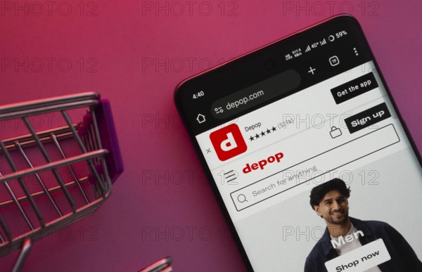 Dhaka, Bangladesh- 23 June 2025: A smartphone displaying the Depop website with a shopping cart is shown on a vibrant background