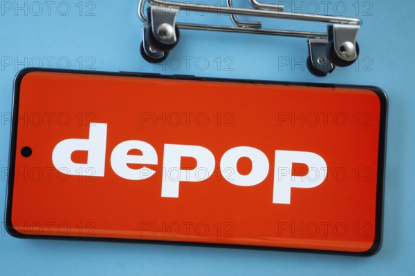 Dhaka, Bangladesh- 03 July 2025: Smartphone screen showing the Depop logo with shopping cart wheels on a blue background