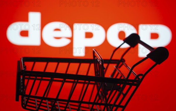 Dhaka, Bangladesh- 03 July 2025: Silhouette of a shopping cart in front of the Depop logo, symbolizing ecommerce and online shopping