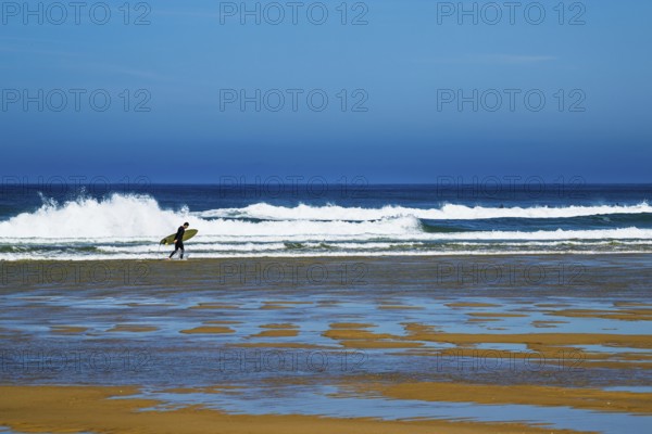 Surfer on Contis beach, Saint Julien en Born, Saint-Julien-en-Born, Landes, France