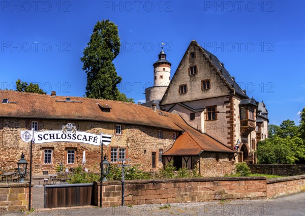 The old castle with Barbarossaplatz and the castle café in the old town centre of Büdingen, Hesse, Germany