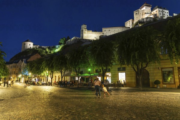 Night shot of the Peace Square in the historic centre of Trencín, Trencín Castle in the background, Capital of Culture 2026, Trencín, Slovakia