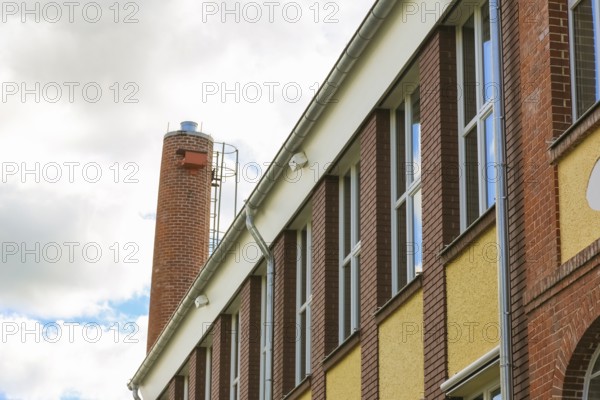New town hall in the former Kindler corset factory, former Gotthold Kindler and Cie. corset factory, factory building, former textile industry, brick, building, lettering, fireplace, chimney, Gomaringen, district of Tübingen, Baden-Württemberg, Germany