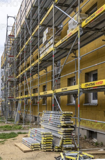 Energy refurbishment of an older residential building, thermal insulation with mineral wool insulation boards, mounted on the façade and then plastered, North Rhine-Westphalia, Germany