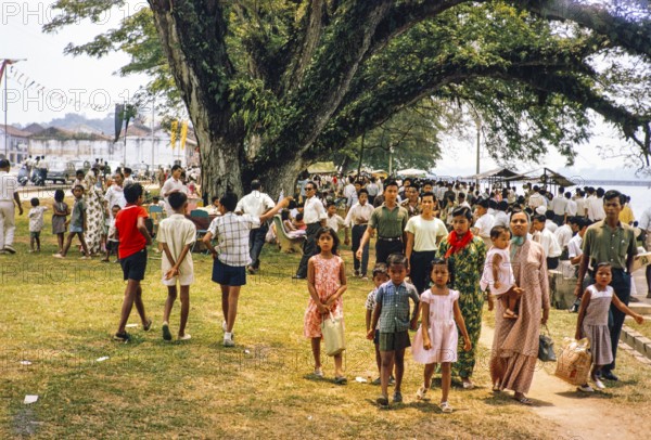 People celebrating having picnics, Waterfront, Johor Bahru, Malaysia, Southeast Asia 1963 - Mawlid festival commemorating the birthday of Islamic prophet Muhammad